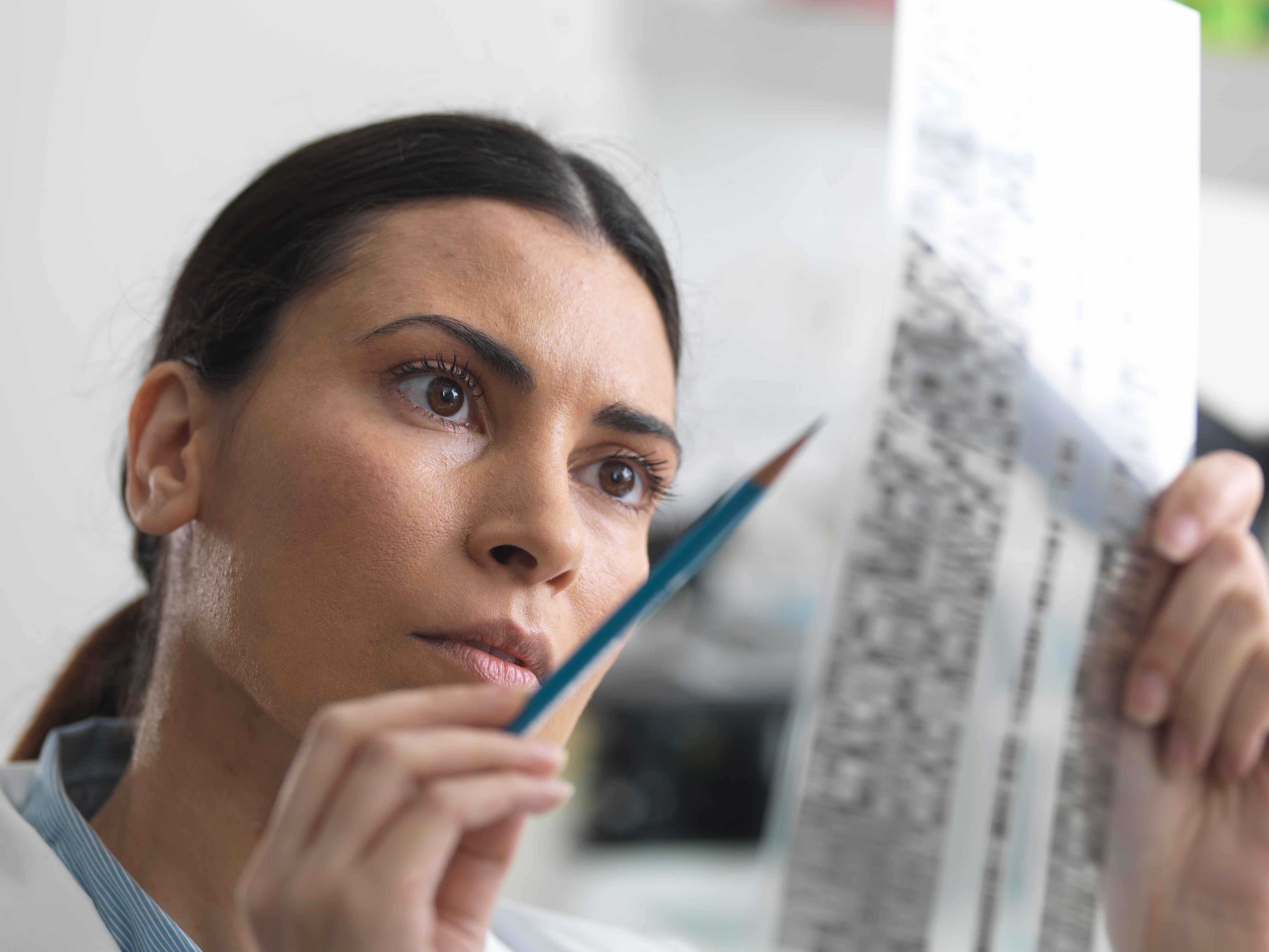 woman looking at receipt