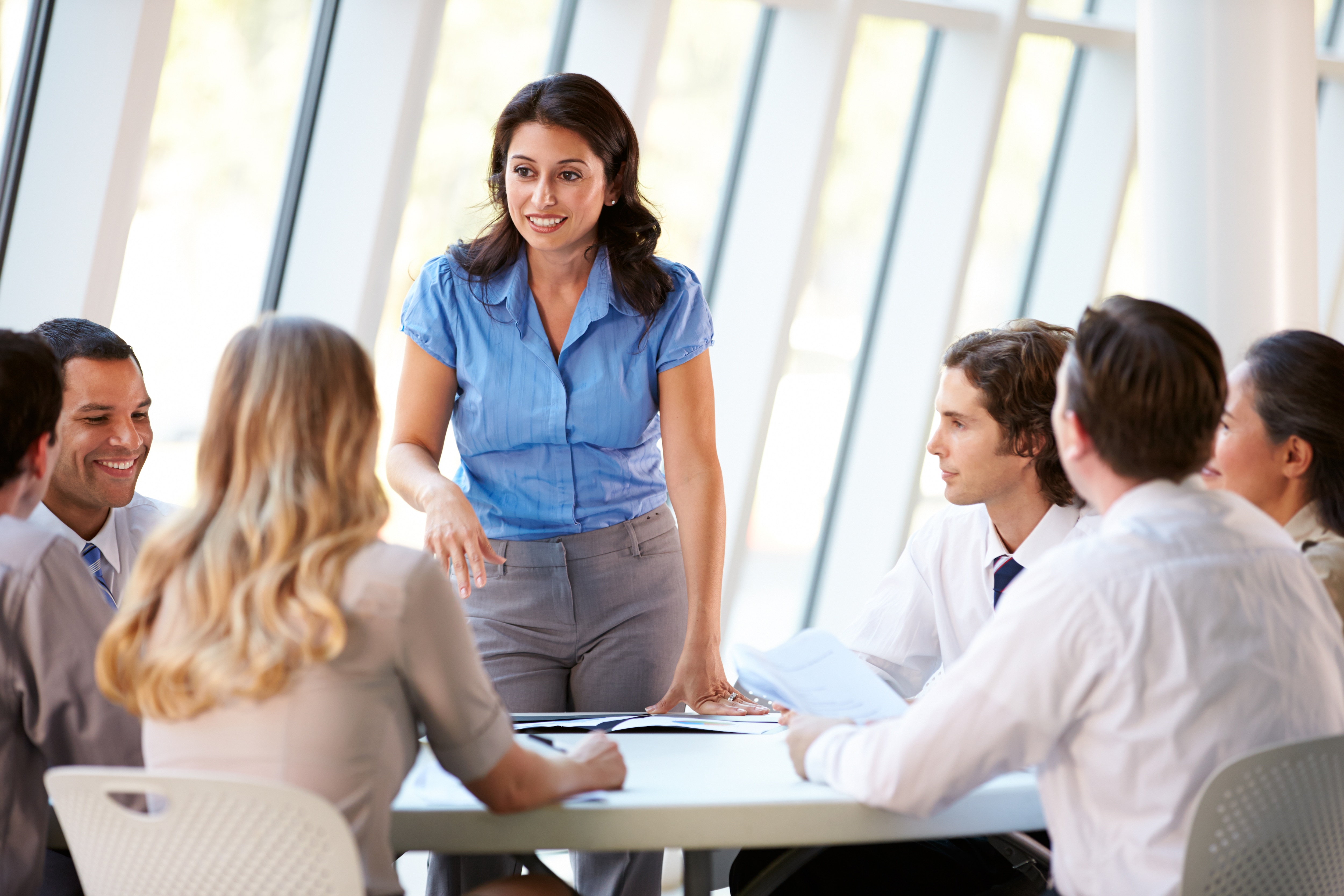 a group of people are having discussions