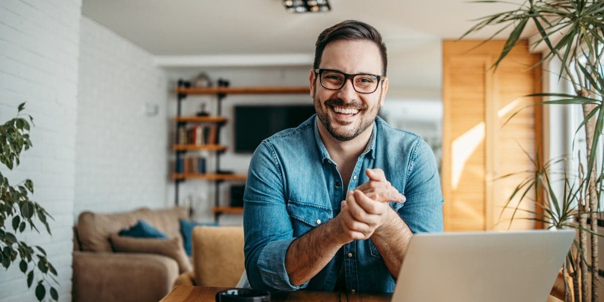 man working remotely at desk