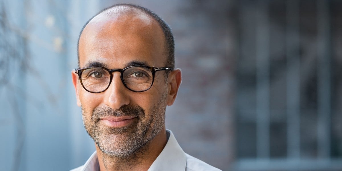 professional man in office smiling