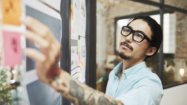 man working on whiteboard